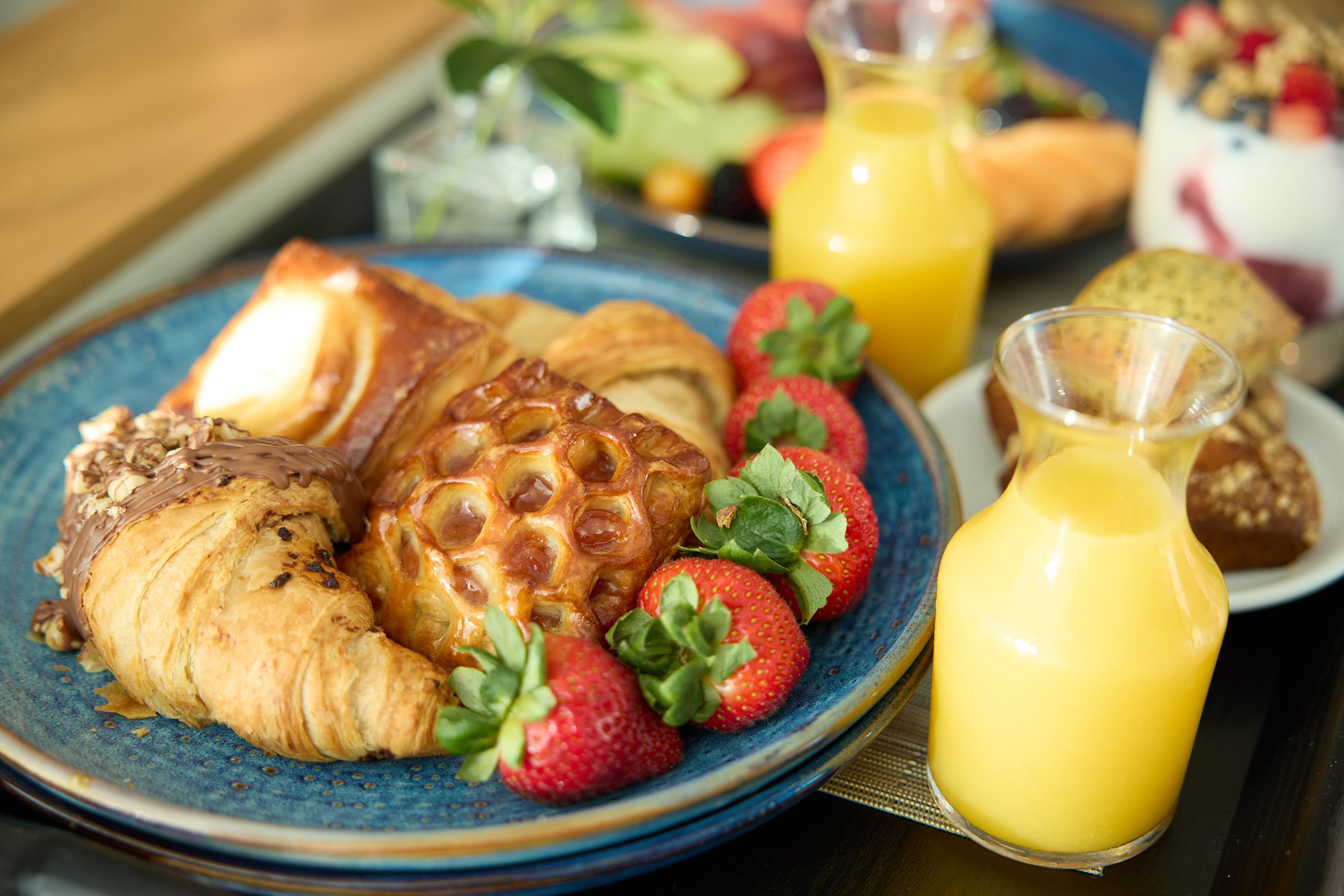 Pastries, fruit, and juice for breakfast