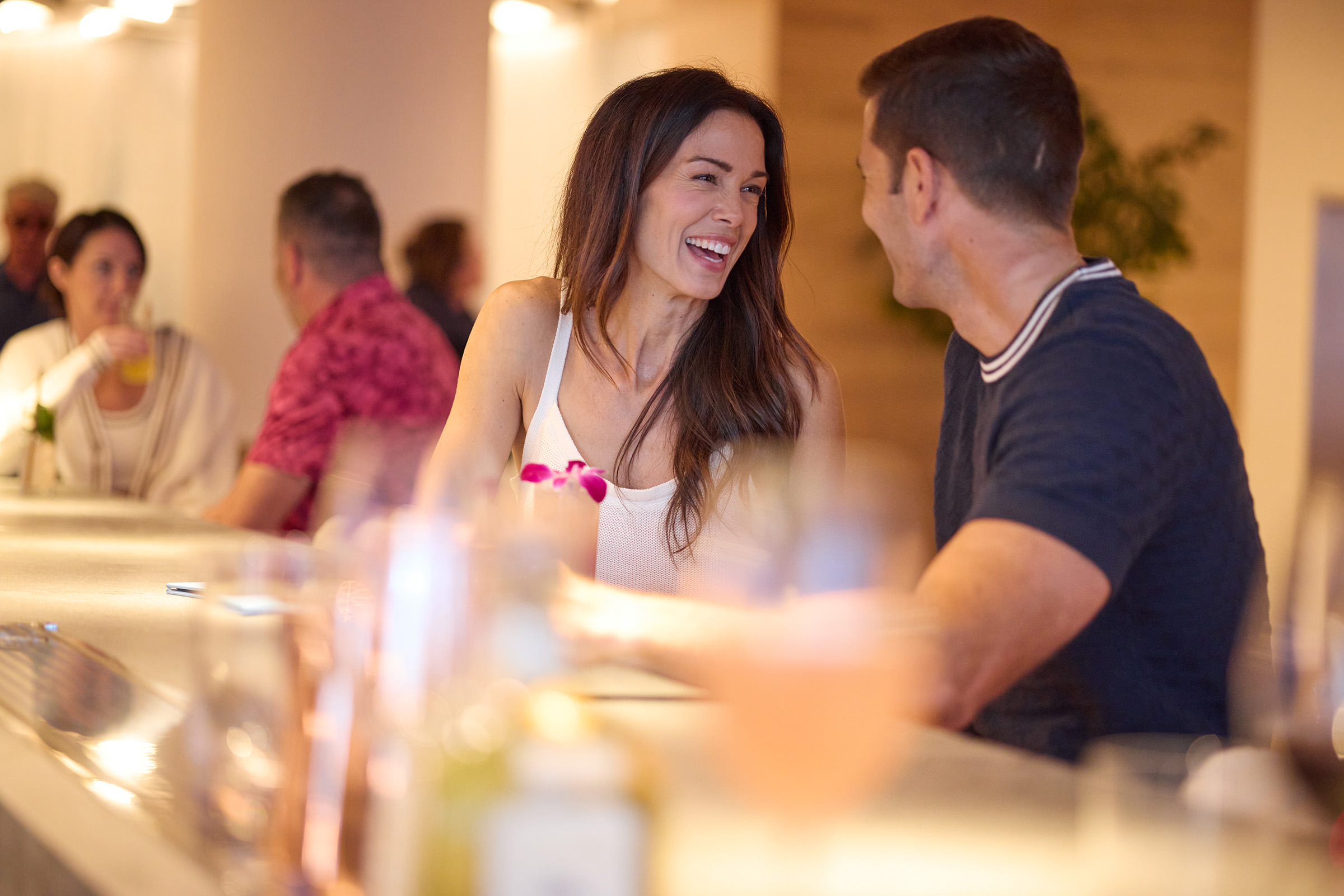 Couple sitting at a bar table, enjoying their company