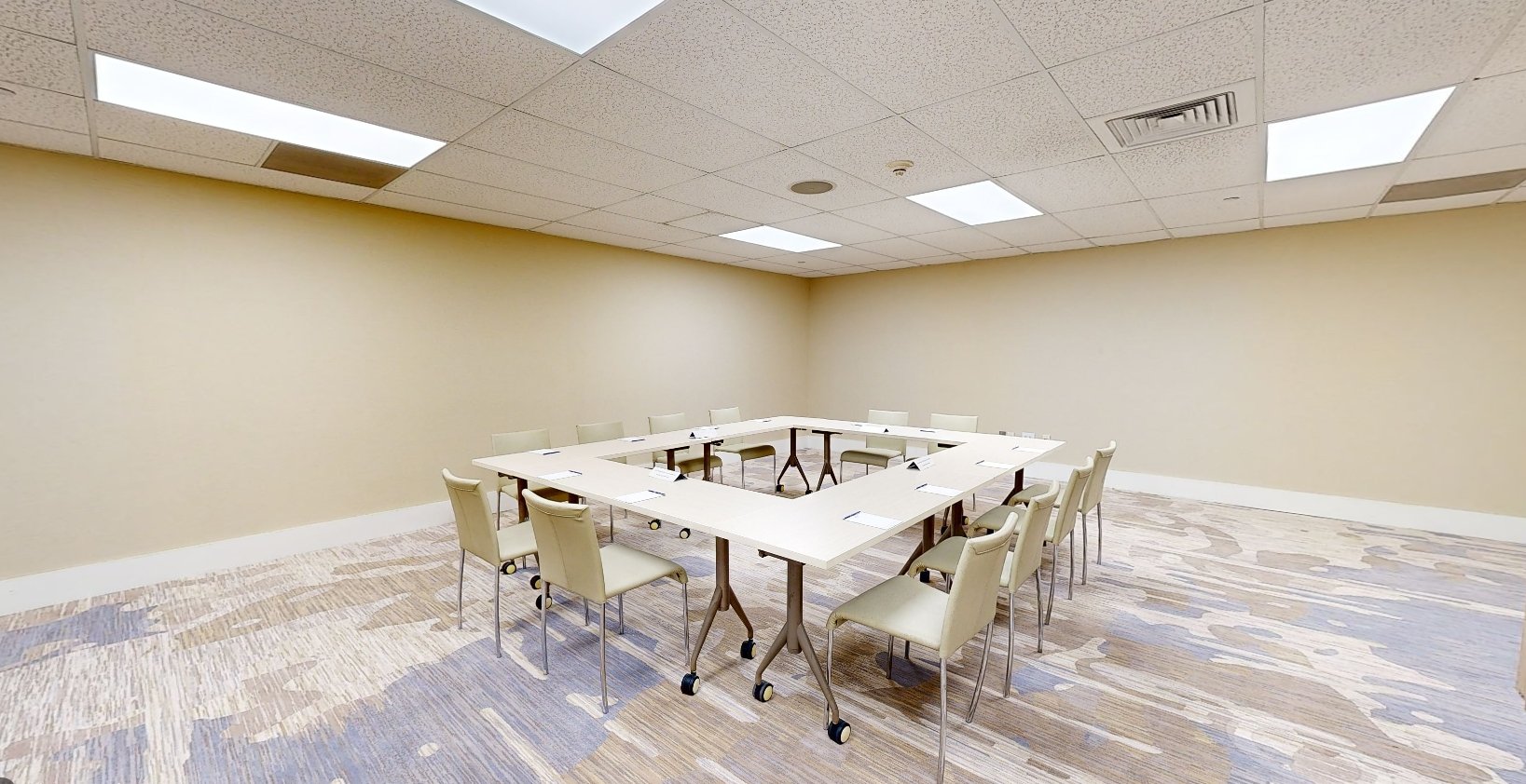 Beach House Fort Lauderdale Tai Yang meeting room, featuring a hollow square meeting table surrounded by chairs