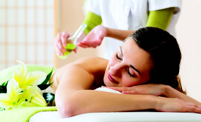 A person receiving an in-suite massage
