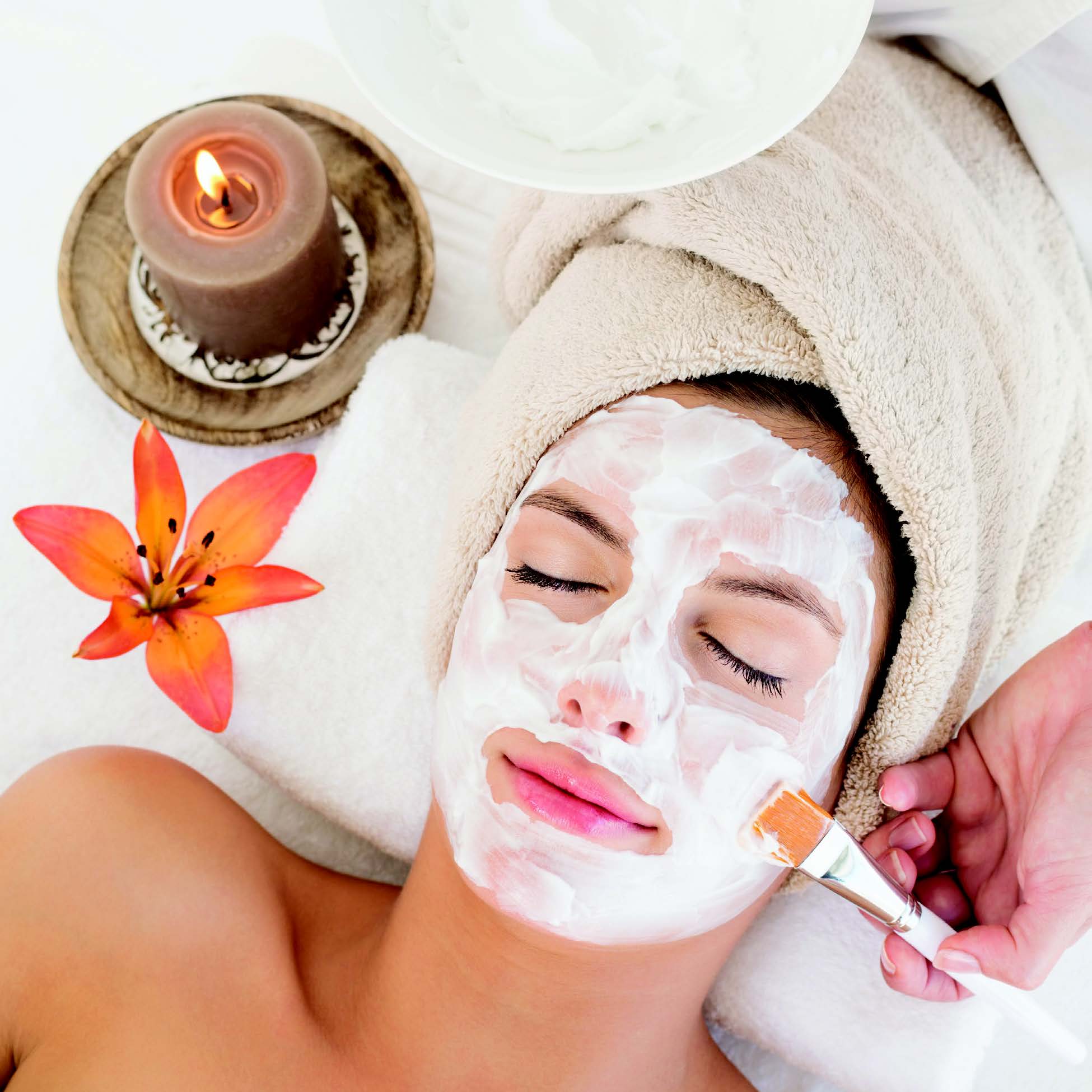 A person receiving a spa facial treatment